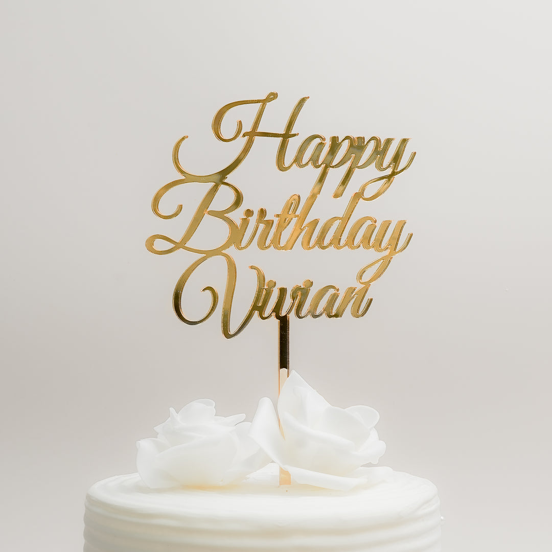 Gold Happy Birthday Vivian cake topper on a white cake